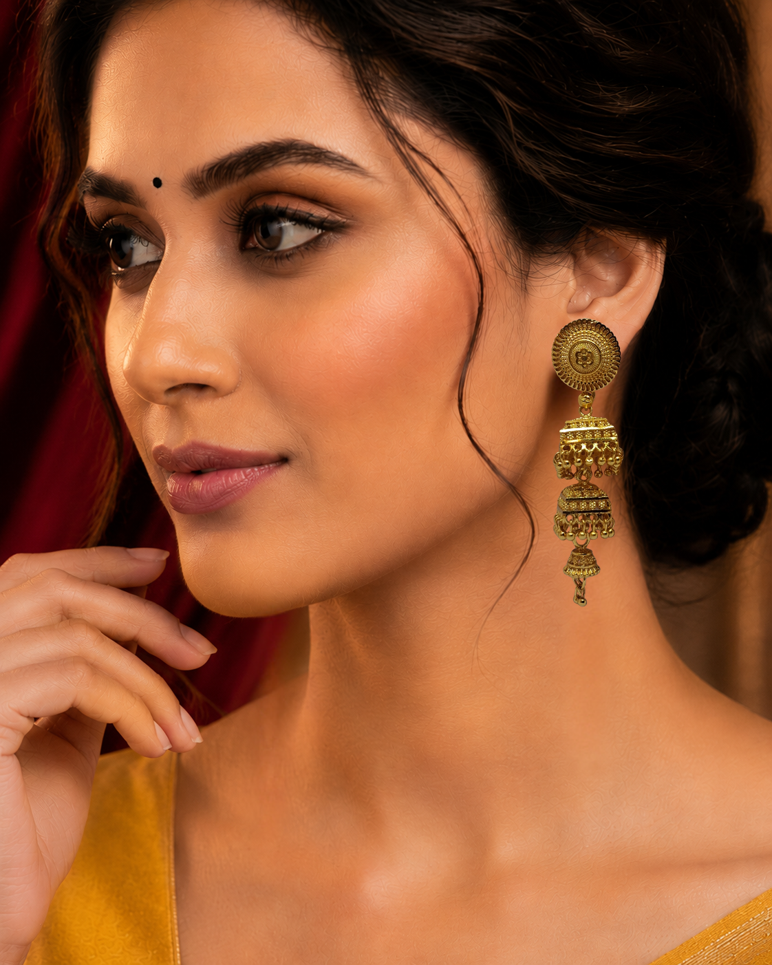 Elegant 3-Layer Hanging Design
✔ Premium Gold-Plated Finish
✔ Intricate Traditional Detailing
✔ Comfortable & Secure Stud Closure
✔ Perfect for Bridal & Festive Wear
✔ Beautiful Dangling Bead Accents
✔ Complements Sarees, Lehengas & Kurtis