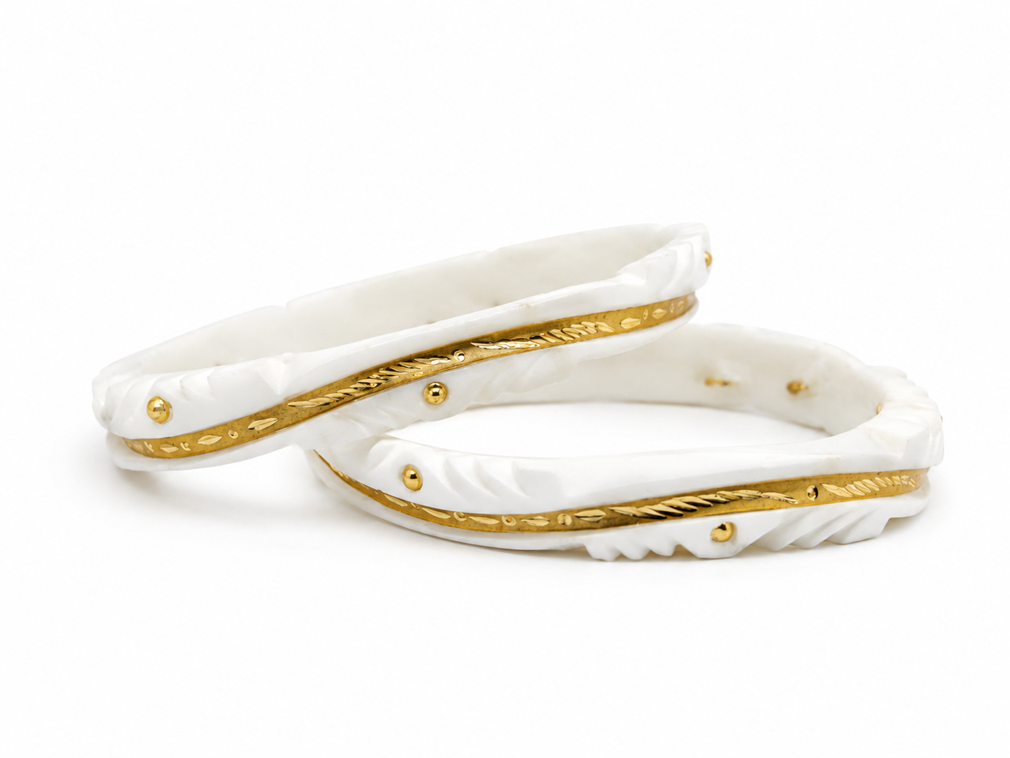 Add timeless elegance to your traditional look with this beautifully crafted White & Gold Designer Shakha Pair. Featuring intricate carved detailing with luxurious gold-tone accents, this lightweight and stylish set is perfect for weddings, festivals, and everyday ethnic wear.