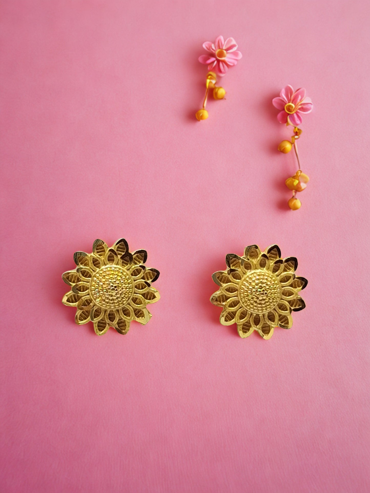 Inspired by the radiant beauty of sunflowers, these earrings feature intricate petal detailing and a textured center that catches the light beautifully.