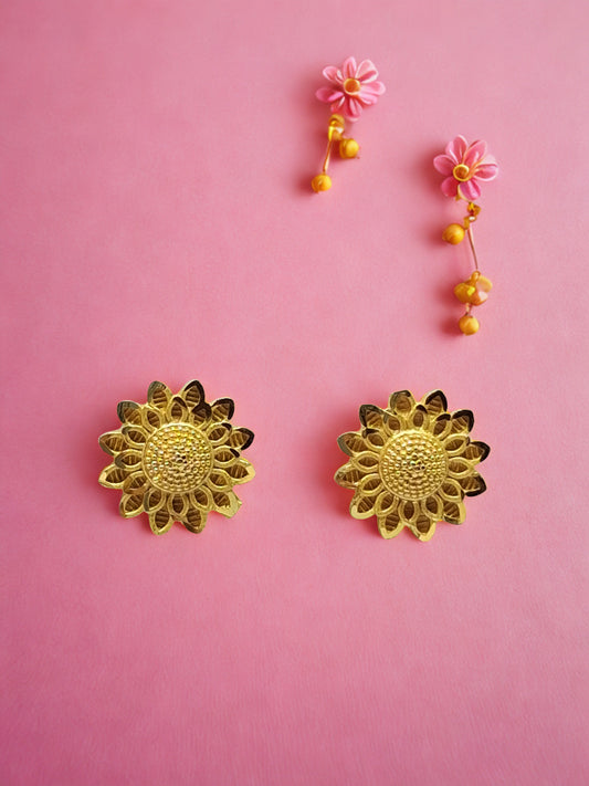 Inspired by the radiant beauty of sunflowers, these earrings feature intricate petal detailing and a textured center that catches the light beautifully.