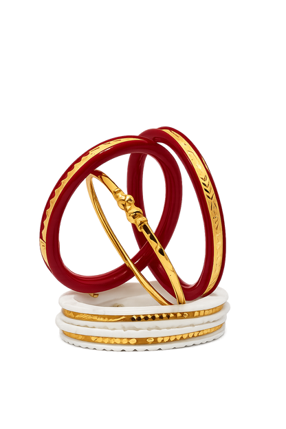 Featuring beautifully engraved gold-plated bangles, classic red Shakha-inspired bangles, elegant white Pola-style bangles, and a matching Noya bracelet, this combo is perfect for weddings, festivals, puja, anniversaries, and daily traditional wear.